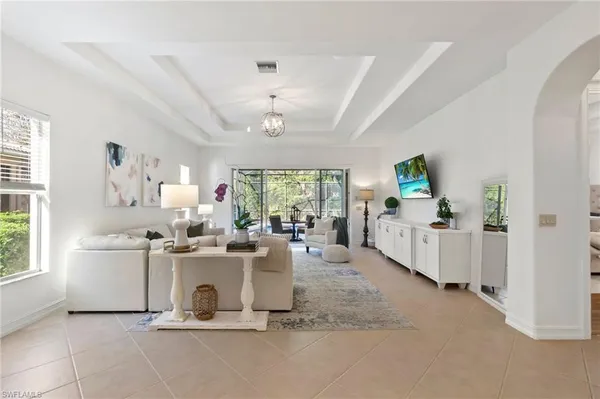 a view of a room with kitchen view and a window