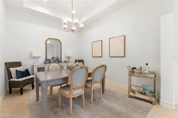 a kitchen with a table chairs and a stove