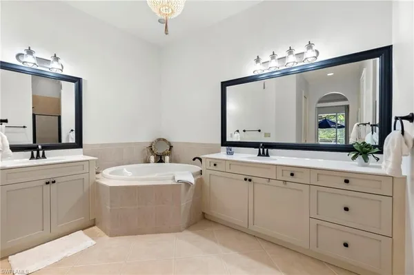 a en suite bathroom with a sink a mirror and a shower
