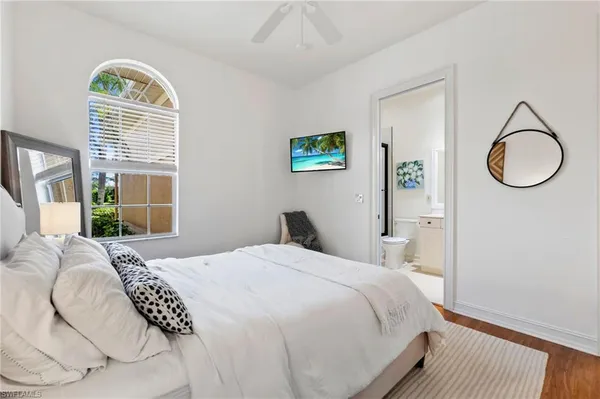 a bedroom with a bed and a desk