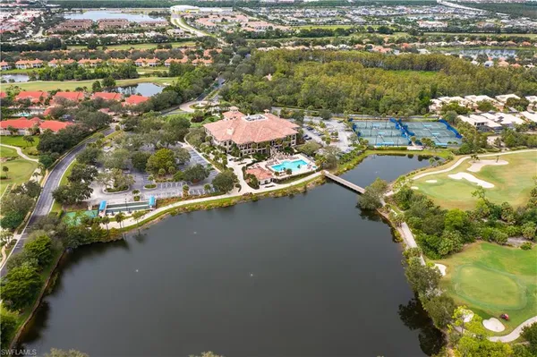 an aerial view of a house with a swimming pool yard and outdoor seating