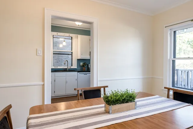 a view of kitchen with furniture and large window