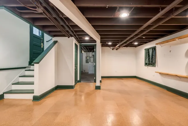 a view of an empty room with stairs