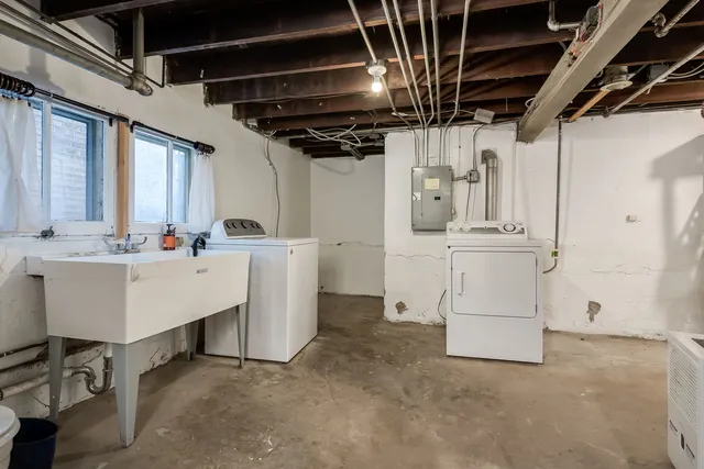 a utility room with a sink a washer and dryer