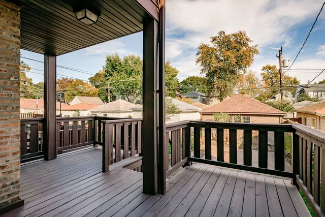 a balcony with wooden floor outdoor seating