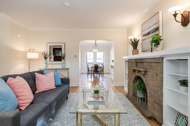 a living room with furniture and a fireplace