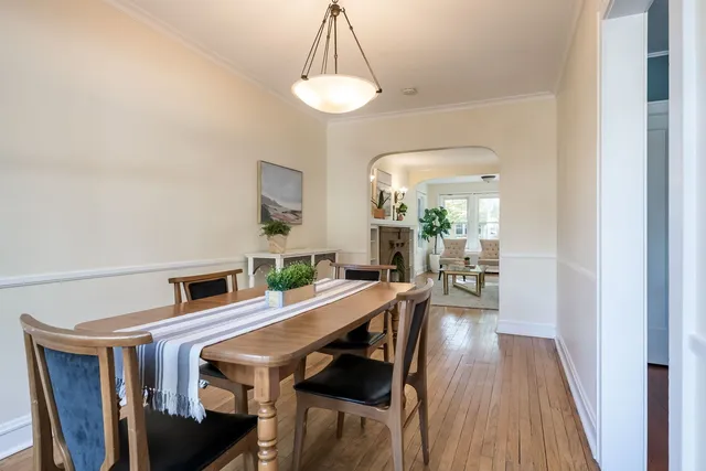 a view of a dining room with furniture and wooden floor