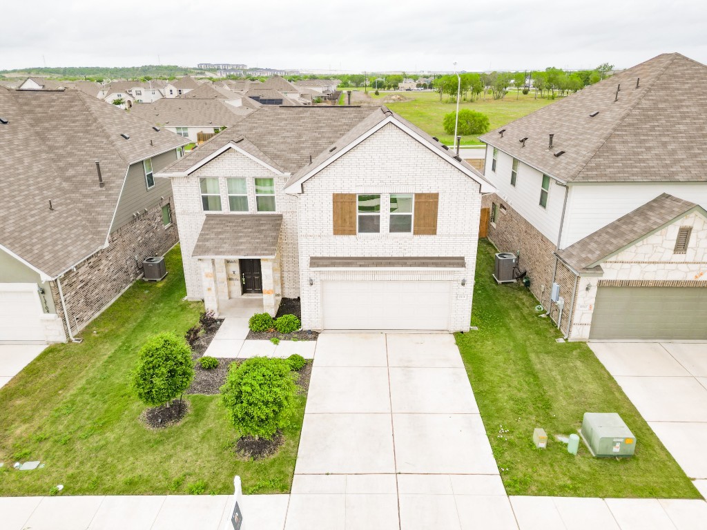 a aerial view of a house with a yard