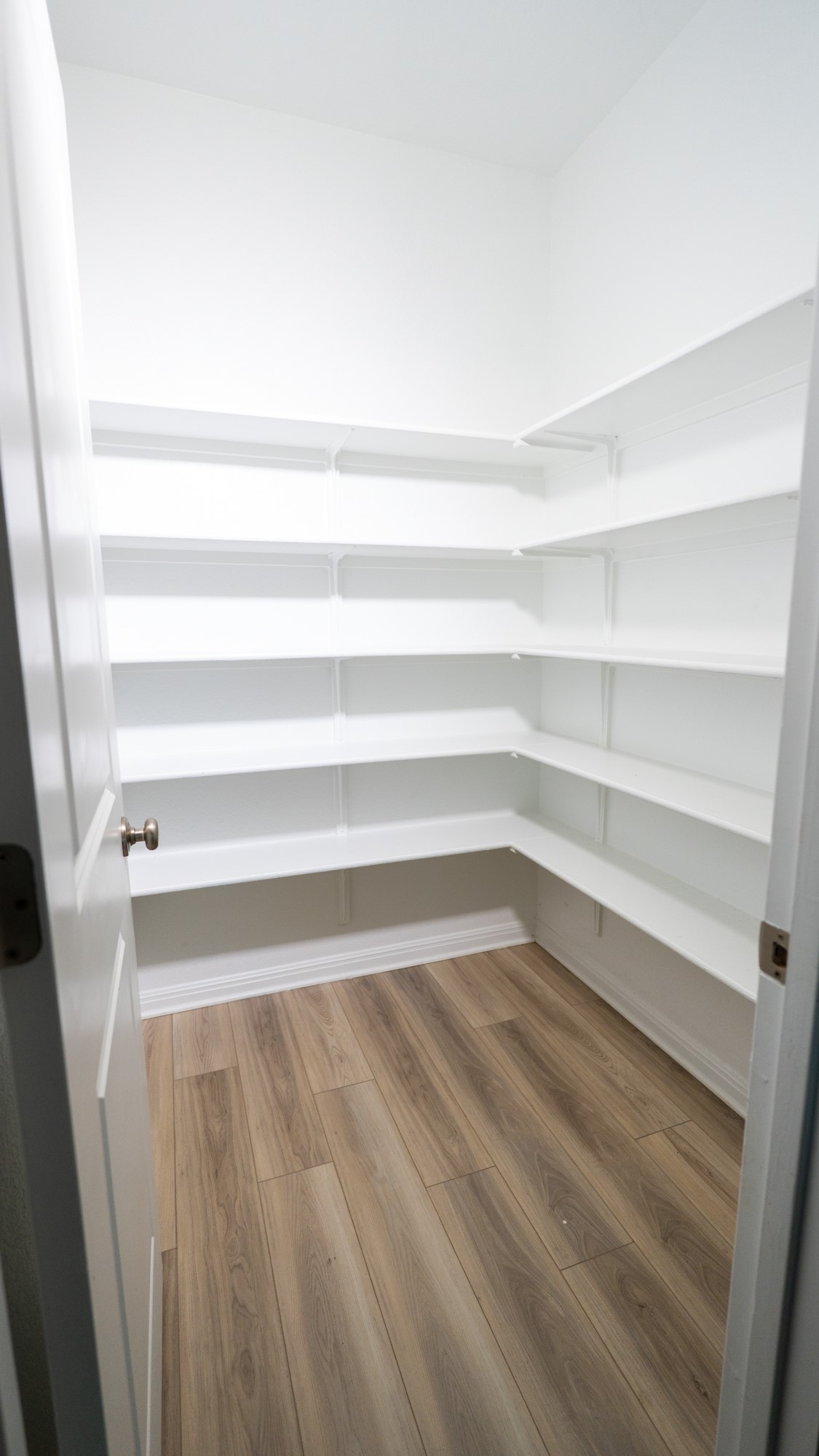 13108 Chapala Way Manor Manor, TX 78653 - Photo 13 of 36 a view of walk in closet with empty racks
