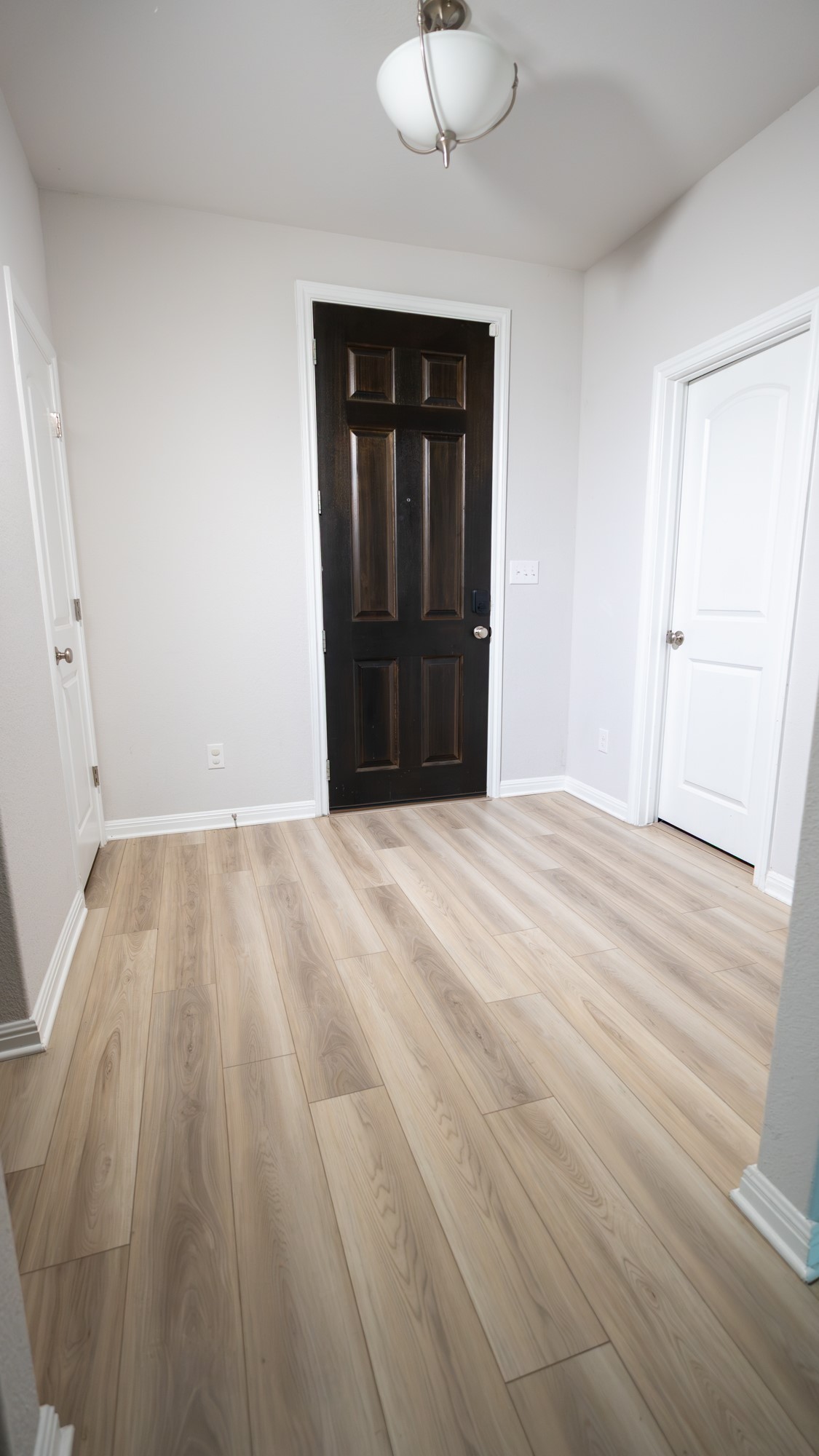 13108 Chapala Way Manor Manor, TX 78653 - Photo 14 of 36 a view of empty room with wooden floor