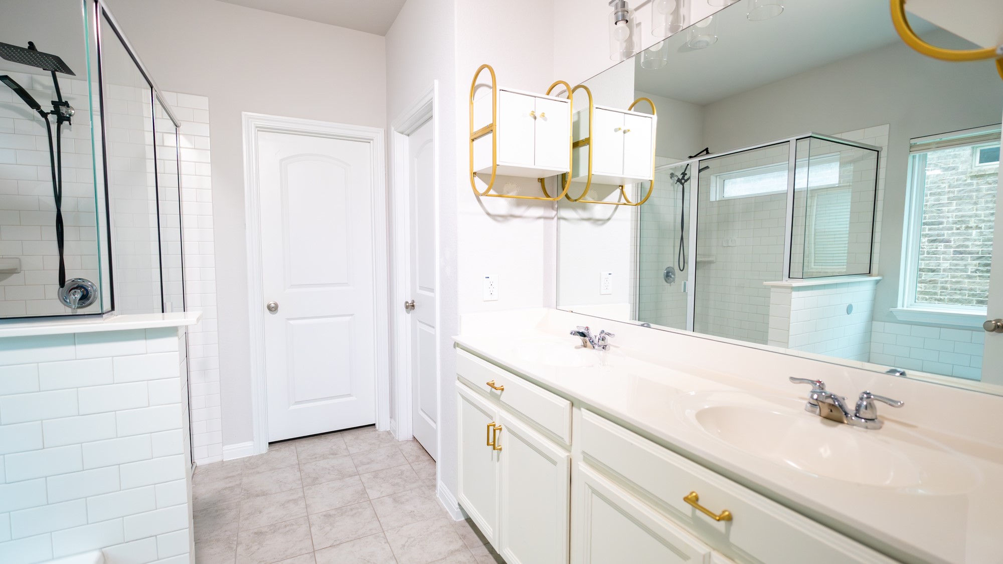 13108 Chapala Way Manor Manor, TX 78653 - Photo 17 of 36 a spacious bathroom with a double vanity sink mirror and double