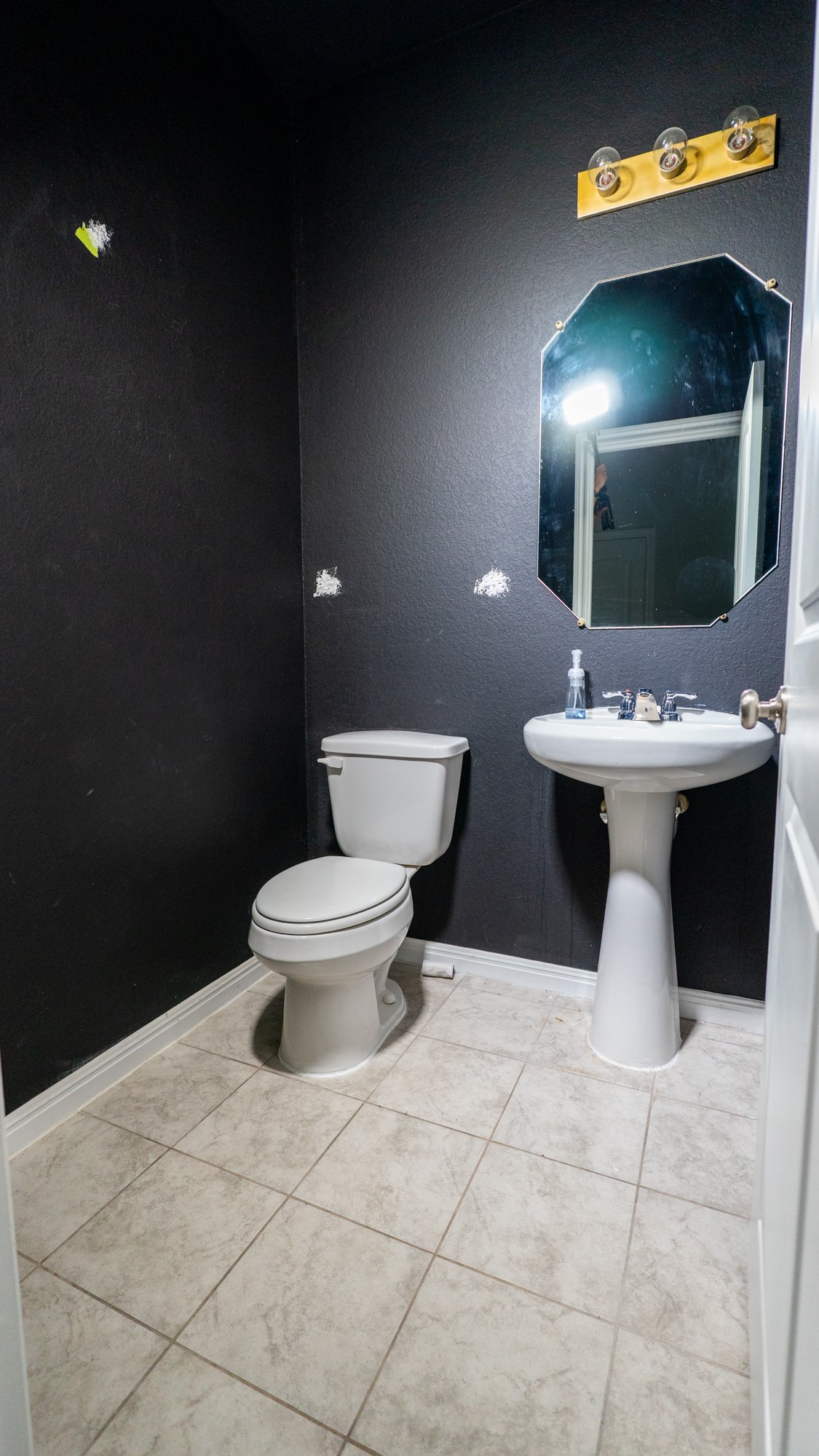 13108 Chapala Way Manor Manor, TX 78653 - Photo 21 of 36 a bathroom with a sink a toilet and a mirror