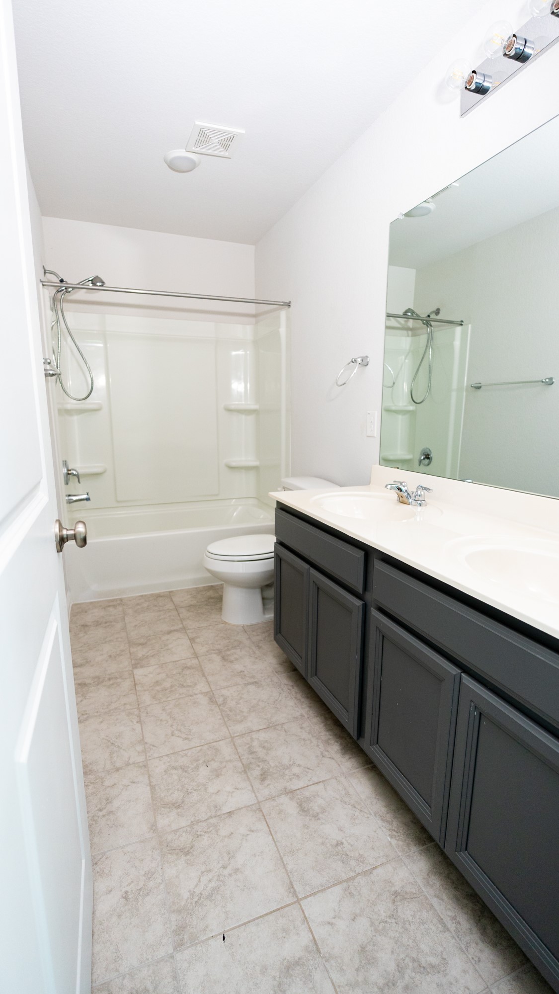 13108 Chapala Way Manor Manor, TX 78653 - Photo 27 of 36 a bathroom with a sink a toilet and a mirror