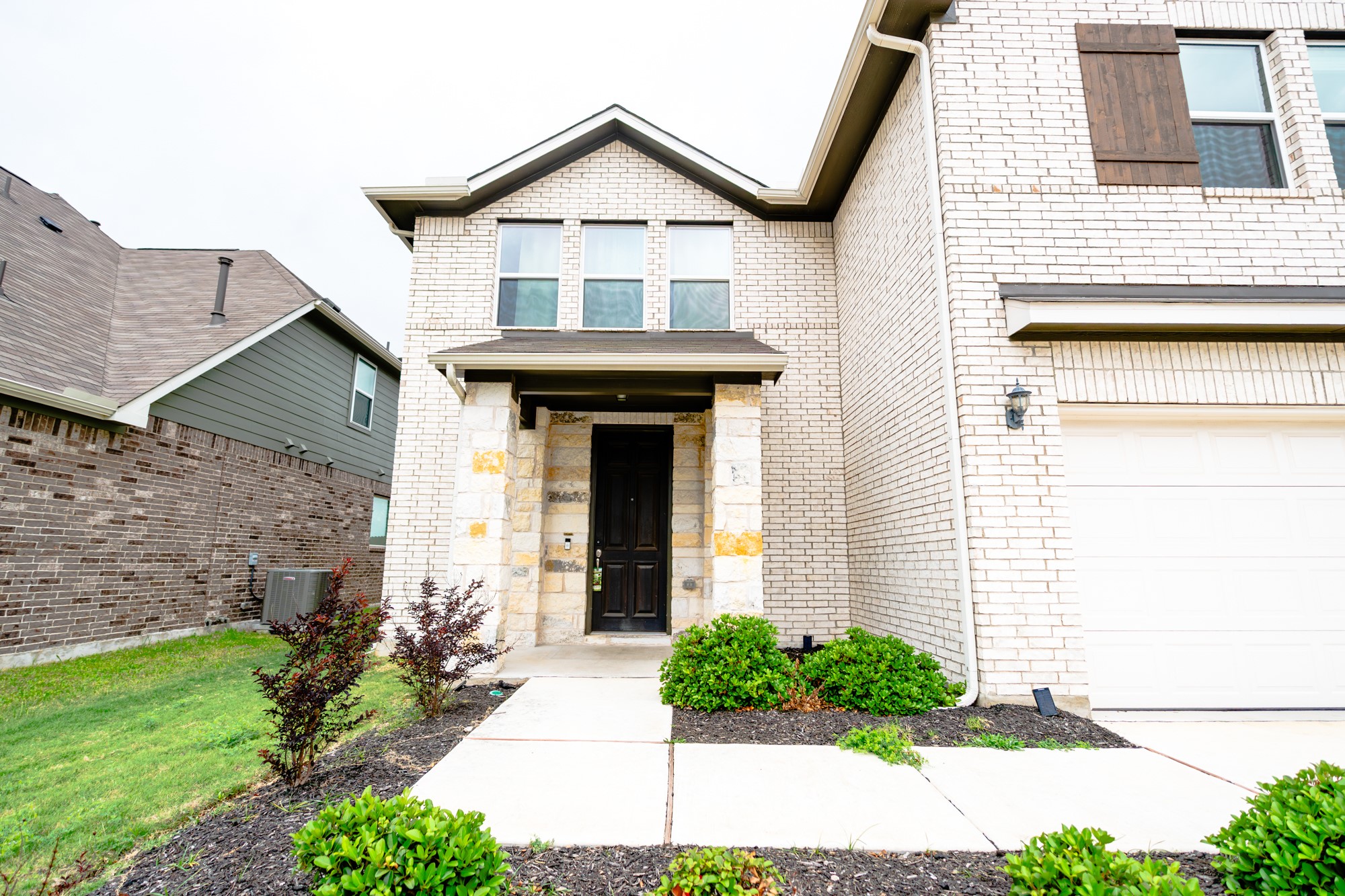13108 Chapala Way Manor Manor, TX 78653 - Photo 3 of 36 a front view of a house with a yard