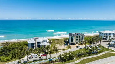 a view of a house with a ocean view