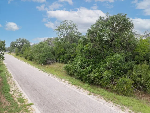 a view of a road with a yard