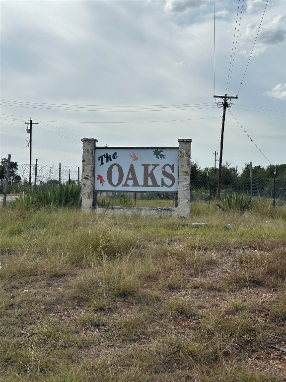 308 The Oaks Boulevard Elgin, TX 78621 - Photo 14 of 14 a view of a sign board
