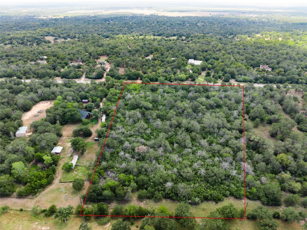 308 The Oaks Boulevard Elgin, TX 78621 - Photo 6 of 14 an aerial view of a houses with a lush green hillside