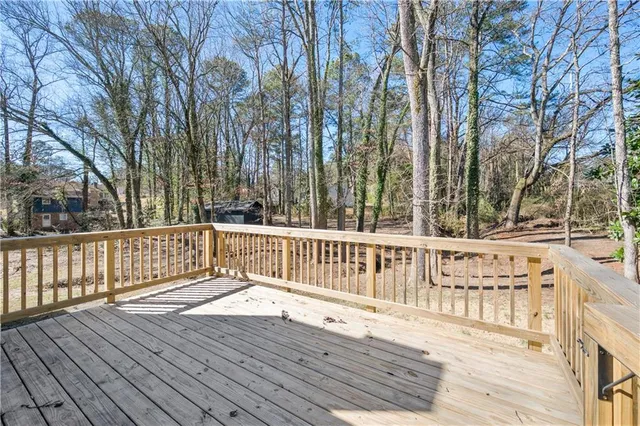 a view of deck with a large trees