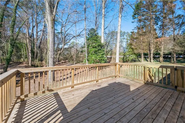 a view of deck with wooden floor and fence