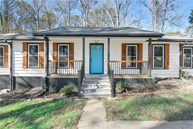 front view of a house with a yard