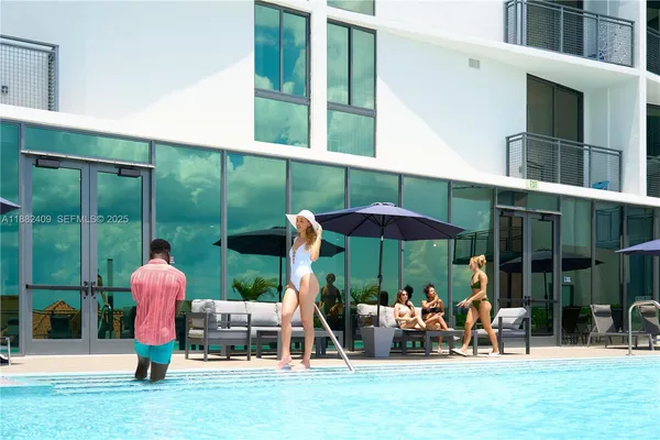 view of living room with furniture and floor to ceiling window
