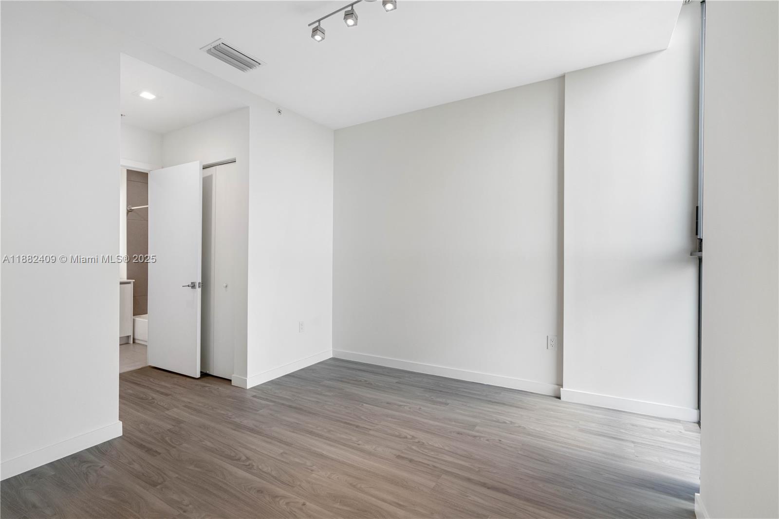 1809 Jackson Street, Unit 709 Hollywood, FL 33020 - Photo 20 of 40 a view of an empty room with wooden floor
