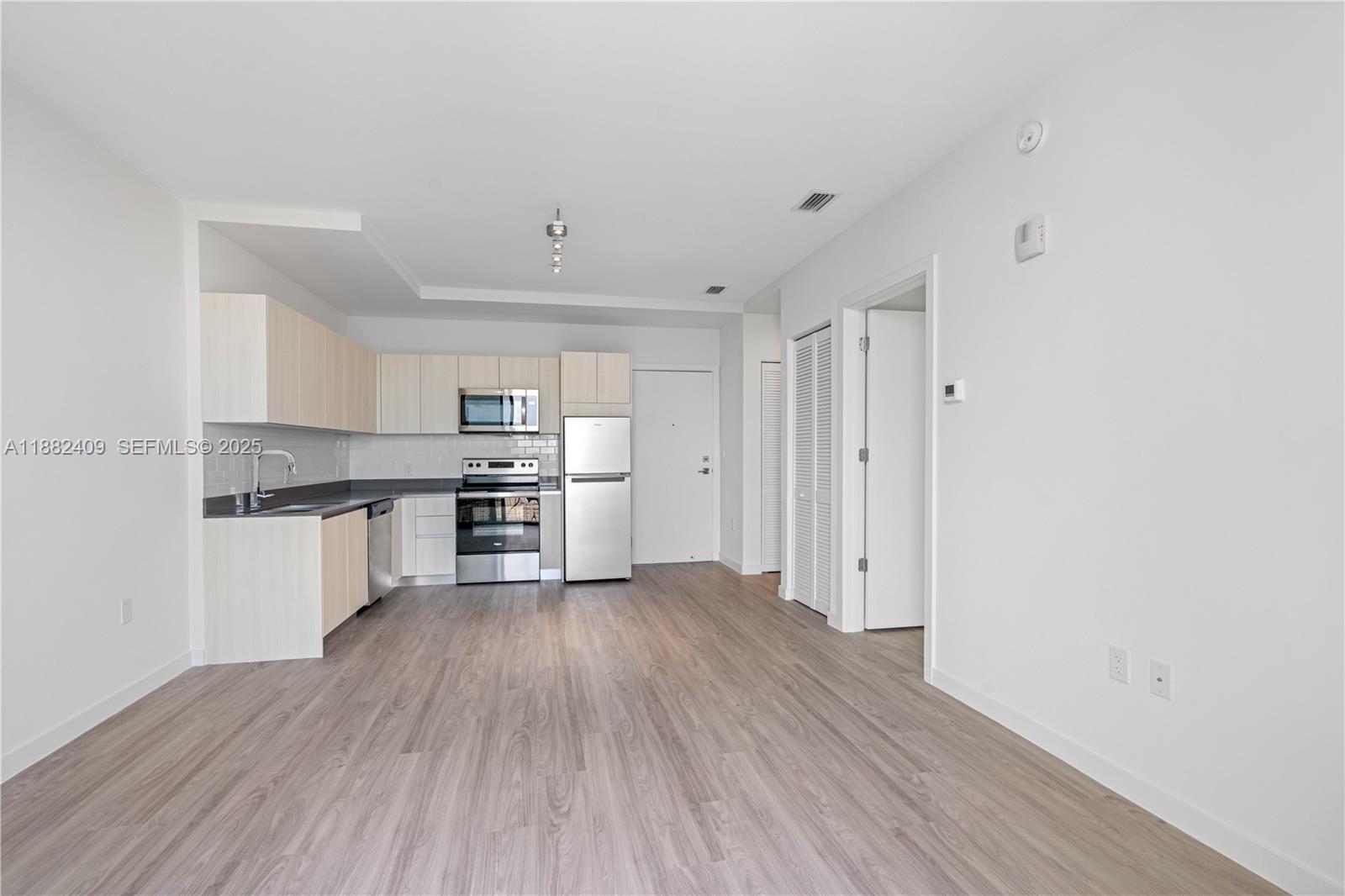 1809 Jackson Street, Unit 709 Hollywood, FL 33020 - Photo 29 of 40 a view of kitchen with wooden floor