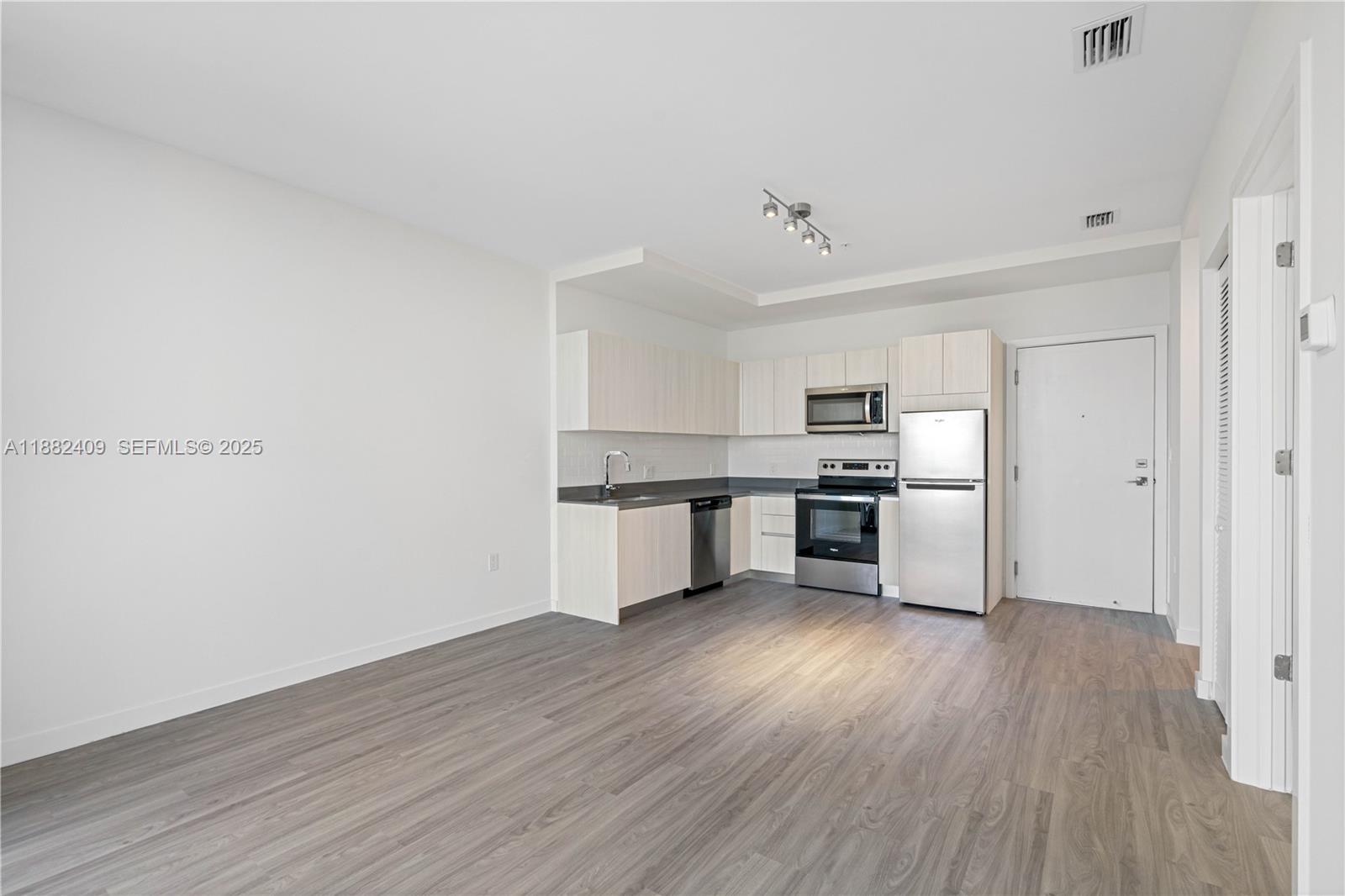 1809 Jackson Street, Unit 709 Hollywood, FL 33020 - Photo 31 of 40 a view of kitchen with wooden floor