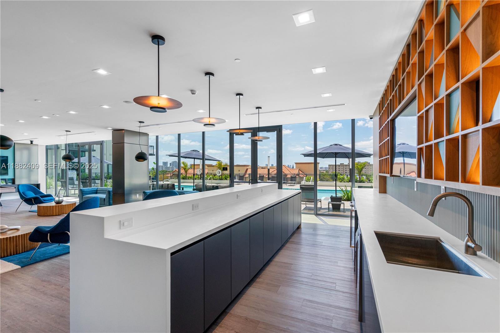 1809 Jackson Street, Unit 709 Hollywood, FL 33020 - Photo 34 of 40 a kitchen with stainless steel appliances granite countertop a sink and wooden floors