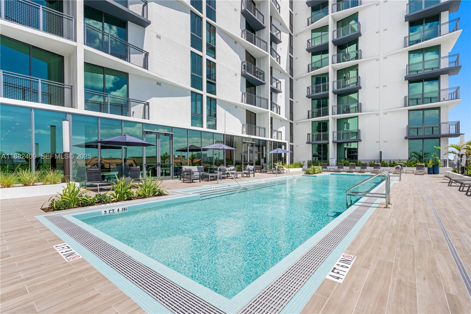 1809 Jackson Street, Unit 709 Hollywood, FL 33020 - Photo 38 of 40 a view of a swimming pool with a patio