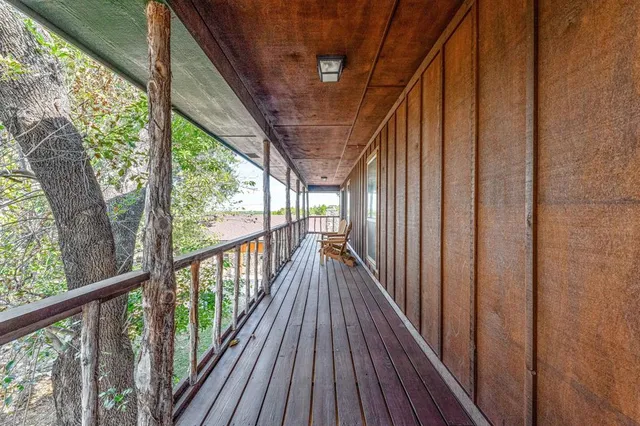 a bathroom with a granite countertop sink mirror and a bathtub with shower