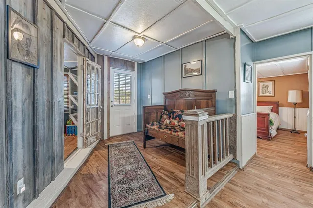 a kitchen with electric appliances a sink and cabinets