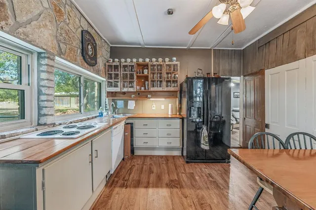 a bed room with a bed and a chandelier