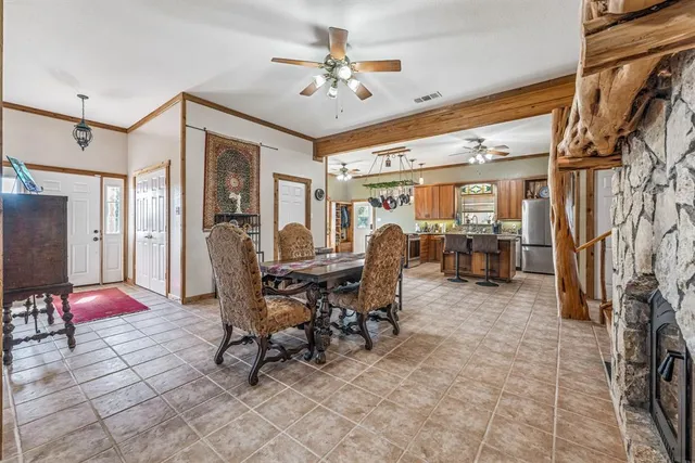 a view of a livingroom with furniture and a ceiling fan