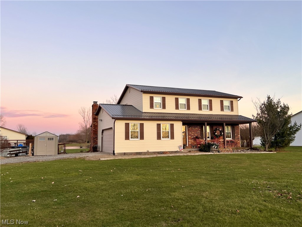 3465 Yost Road Litchfield, OH 44253 - Photo 1 of 27 View of front of house with a lawn and a shed