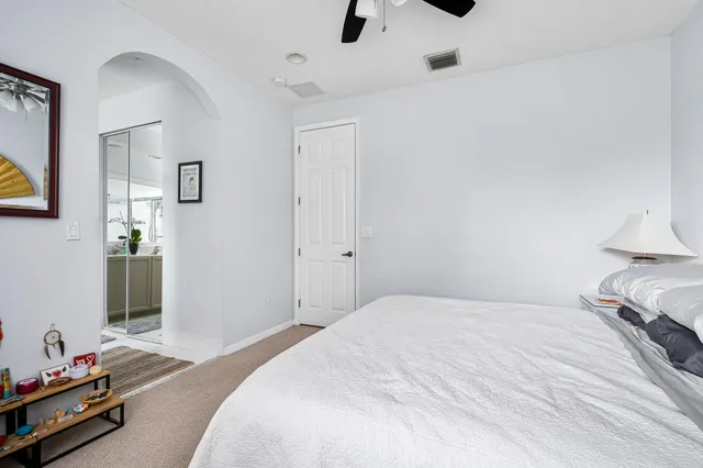 a bedroom with a bed and a dresser