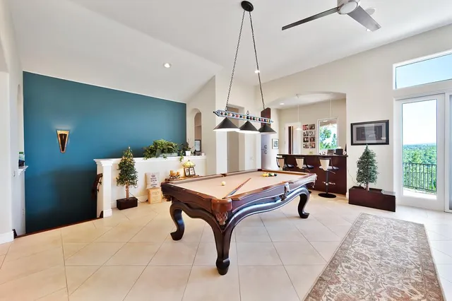 a bathroom with a granite countertop sink mirror and shower