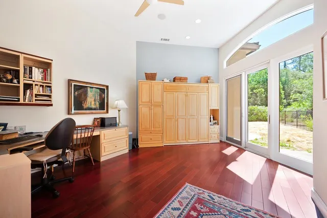 a kitchen with stainless steel appliances granite countertop a refrigerator a sink and wooden cabinets