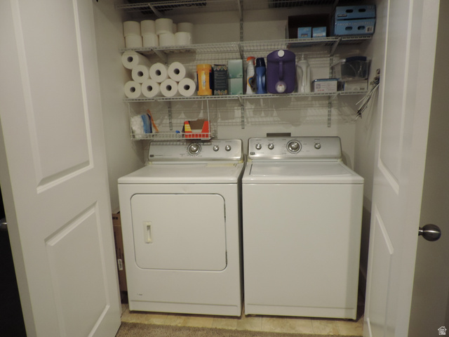 758 South 650 West Logan, UT 84321 - Photo 15 of 18 Laundry closet with white bi-fold doors, white wire shelving, and built-in appliances