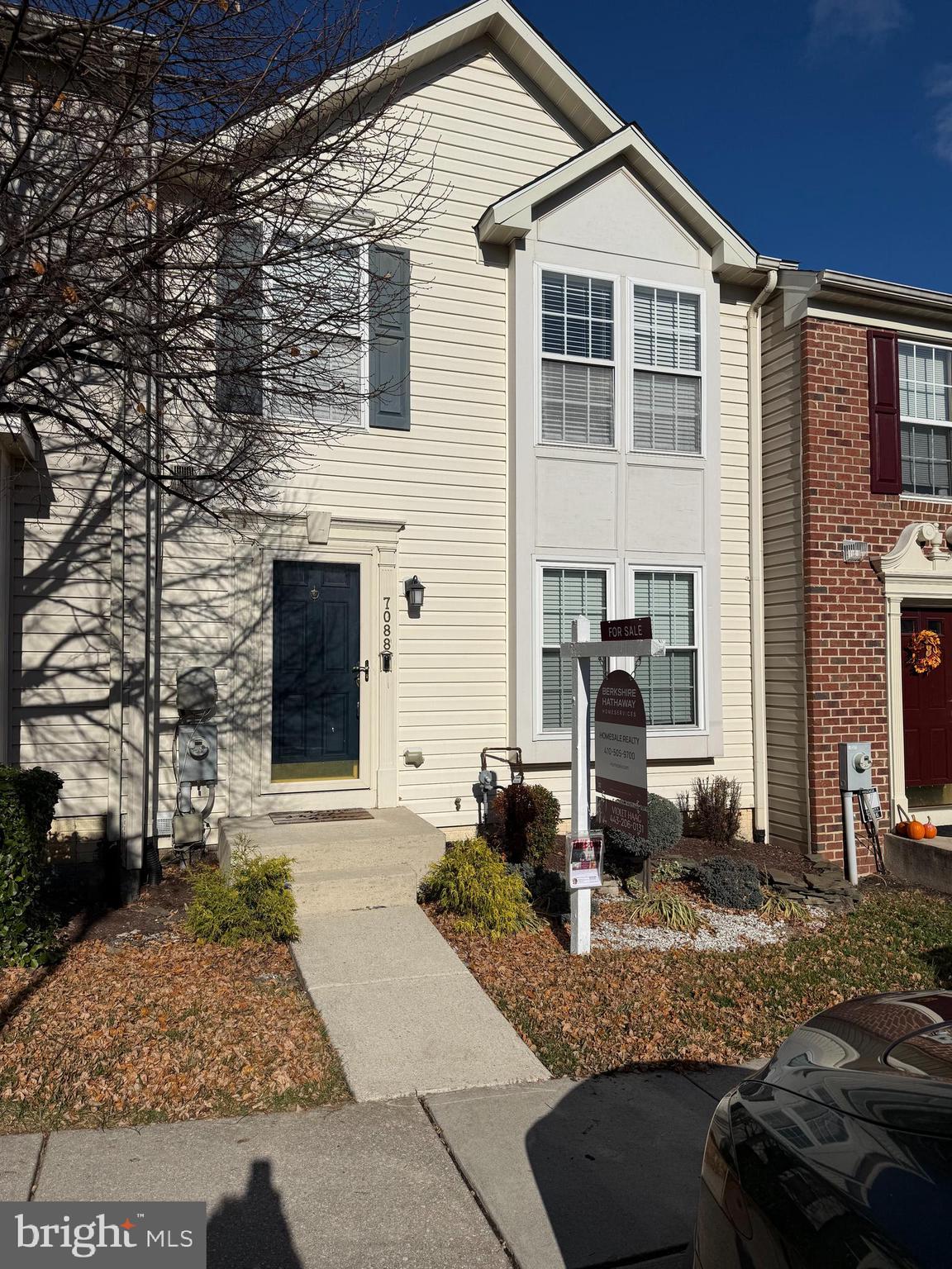 7088 Maiden Point Place, Unit 25 Elkridge, MD 21075 - Photo 1 of 16 a front view of a house with garden