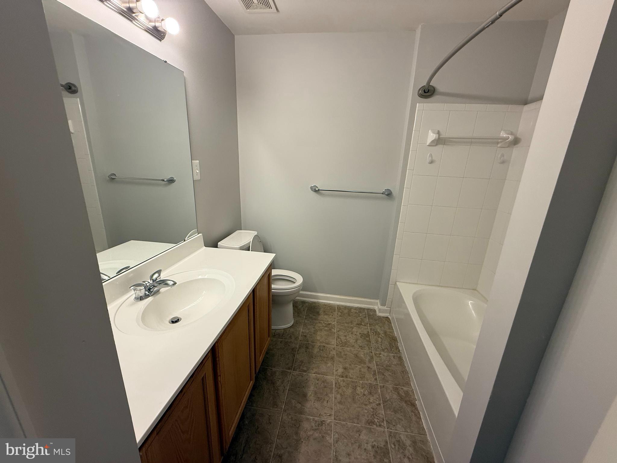 7088 Maiden Point Place, Unit 25 Elkridge, MD 21075 - Photo 12 of 16 a bathroom with a sink a toilet and shower