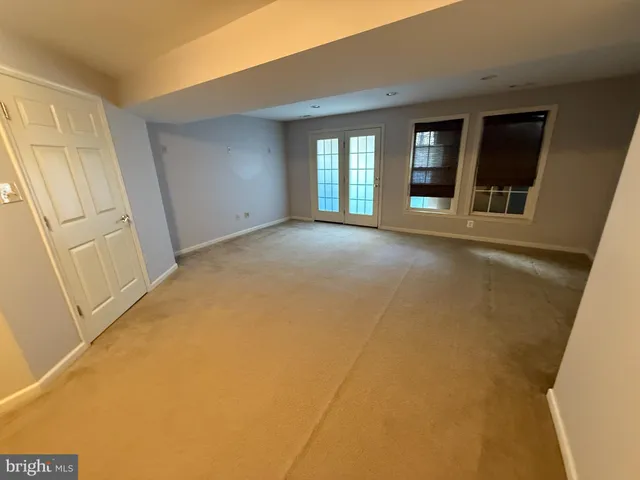 a view of an empty room with a fireplace