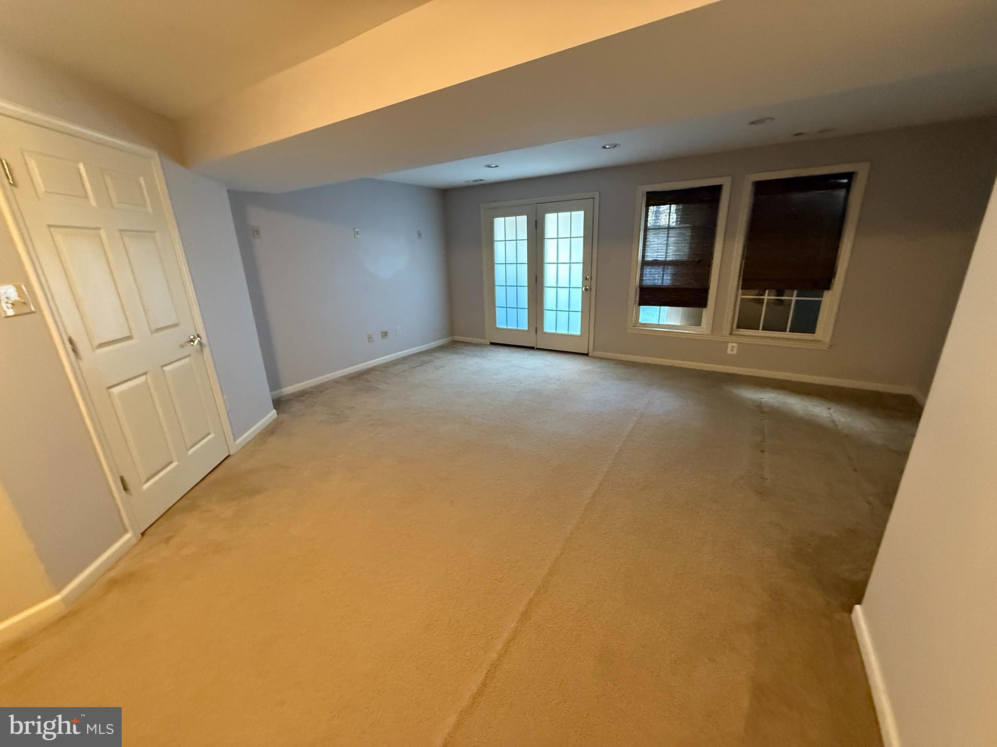 7088 Maiden Point Place, Unit 25 Elkridge, MD 21075 - Photo 13 of 16 a view of an empty room with a fireplace