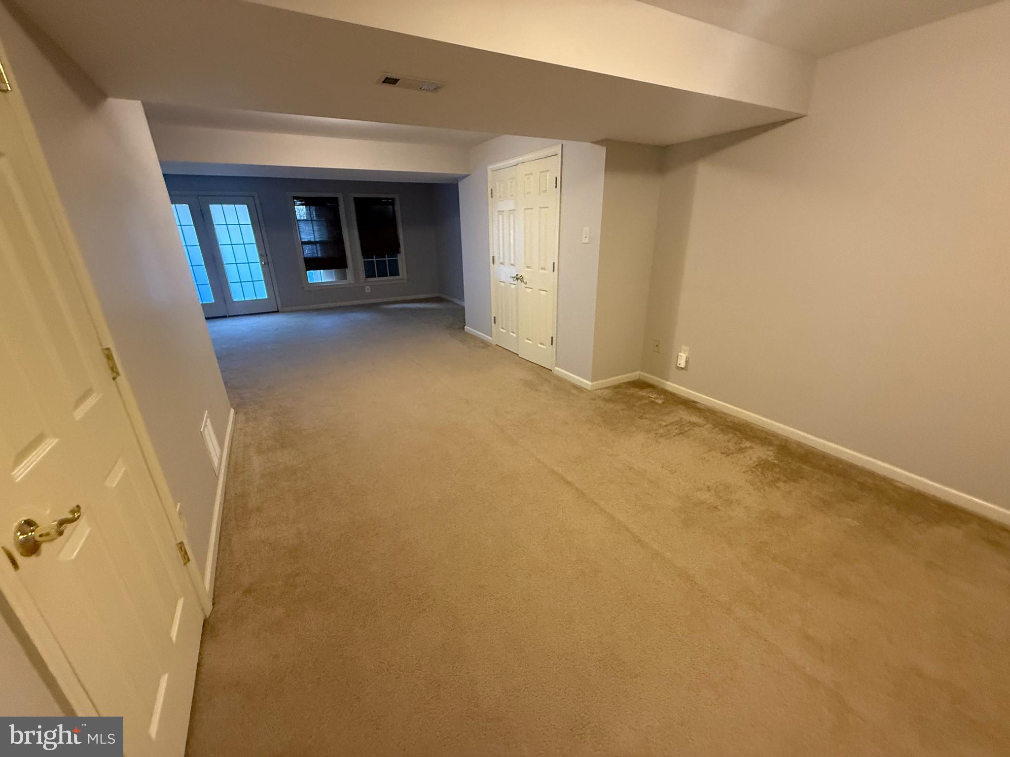 7088 Maiden Point Place, Unit 25 Elkridge, MD 21075 - Photo 14 of 16 an empty room with windows