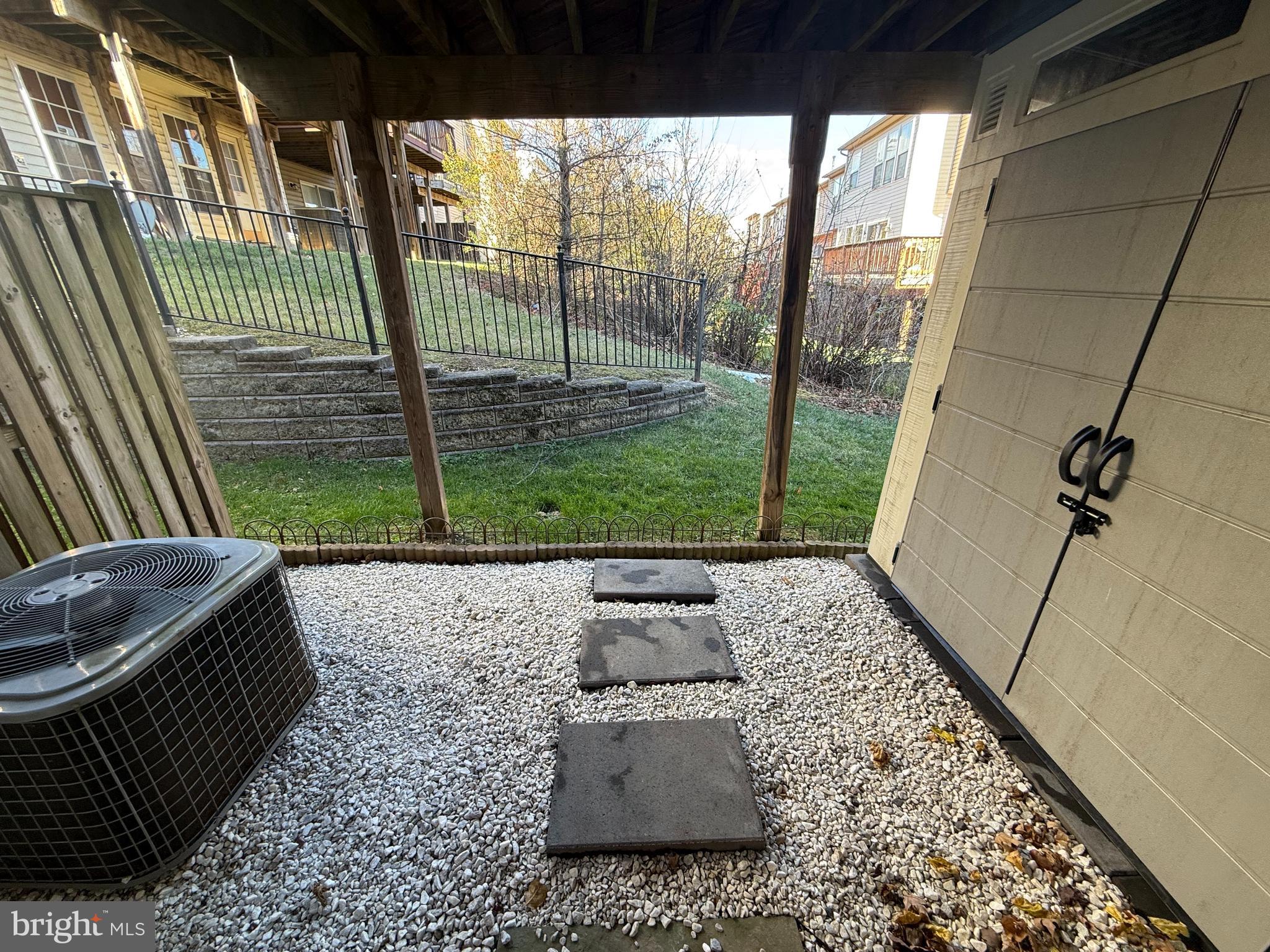 7088 Maiden Point Place, Unit 25 Elkridge, MD 21075 - Photo 16 of 16 a view of a porch with furniture and floor to ceiling window