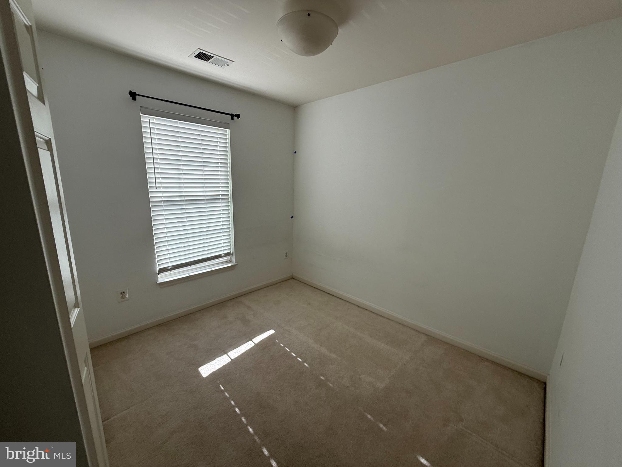 7088 Maiden Point Place, Unit 25 Elkridge, MD 21075 - Photo 10 of 16 an empty room with windows