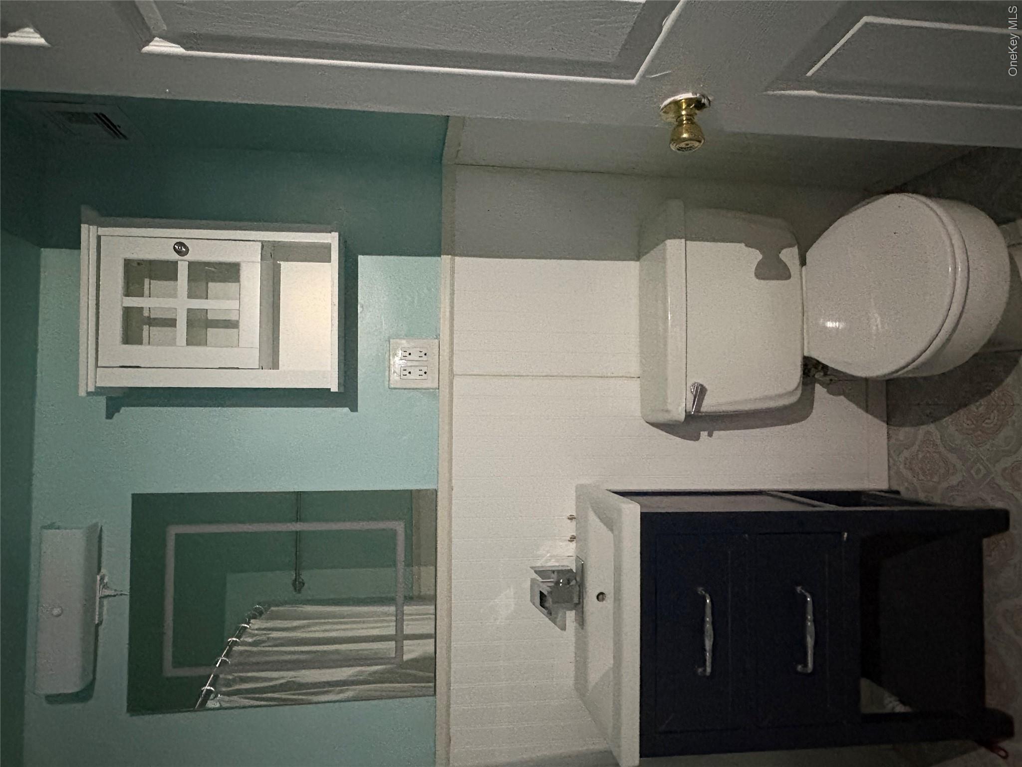 3121 Middletown Road, Unit 1G Bronx, NY 10461 - Photo 12 of 19 a bathroom with a toilet sink and mirror