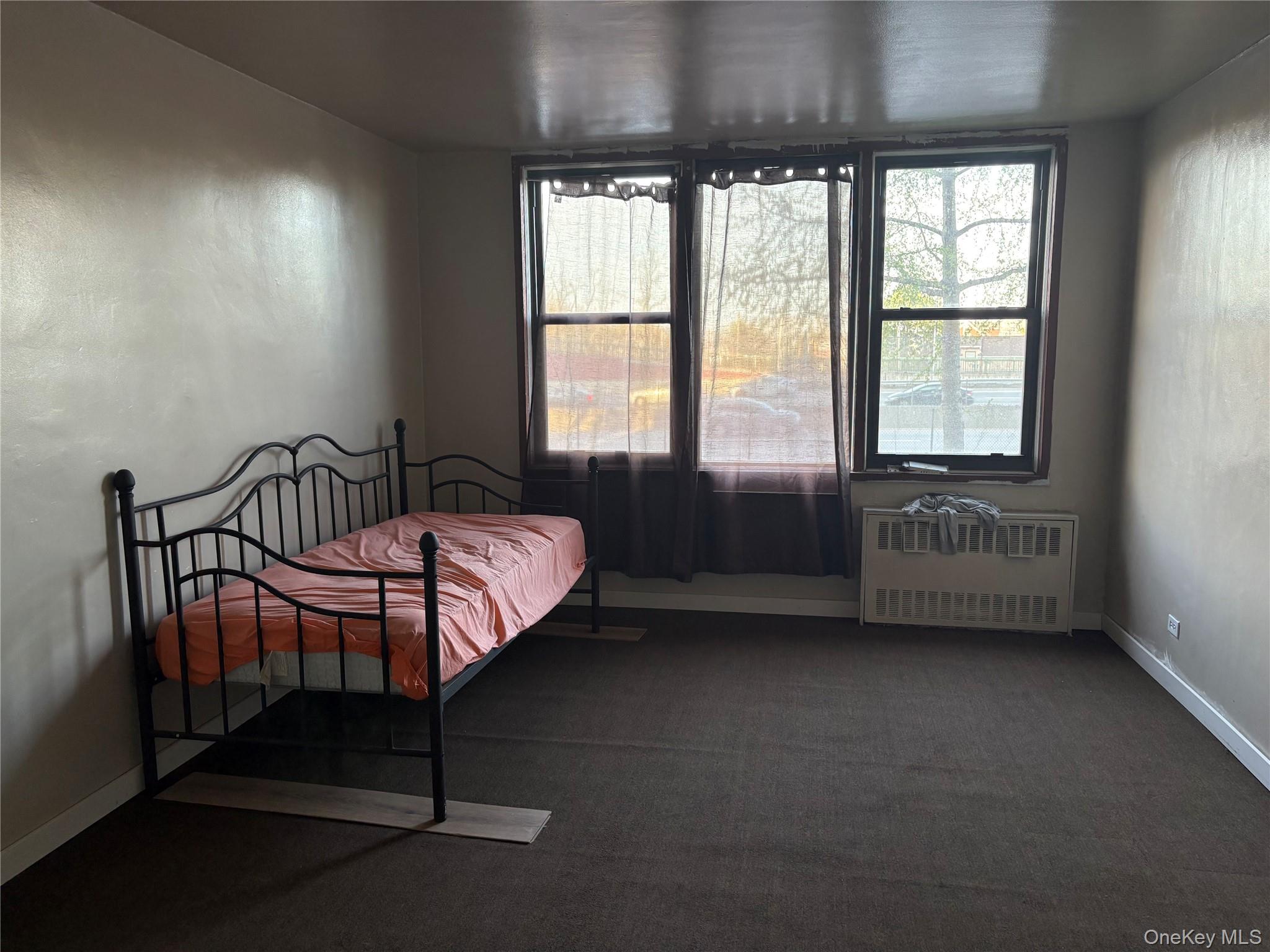 3121 Middletown Road, Unit 1G Bronx, NY 10461 - Photo 8 of 19 a bedroom with a bed chair and window