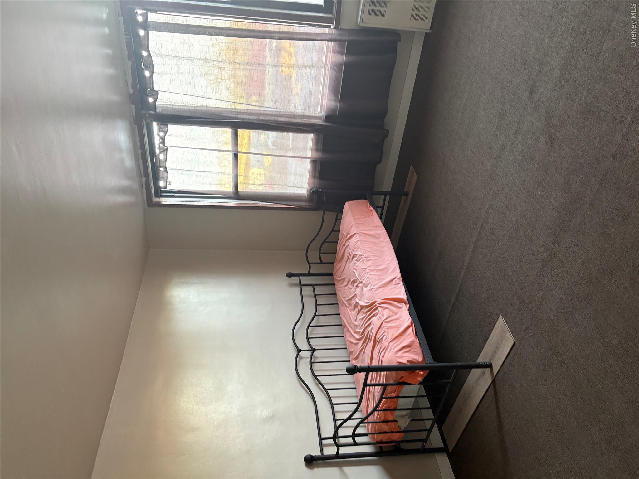 3121 Middletown Road, Unit 1G Bronx, NY 10461 - Photo 9 of 19 a bedroom with a bed and window